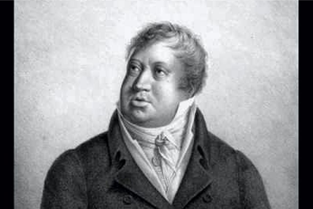 Black-and-white portrait of historical man in formal coat
