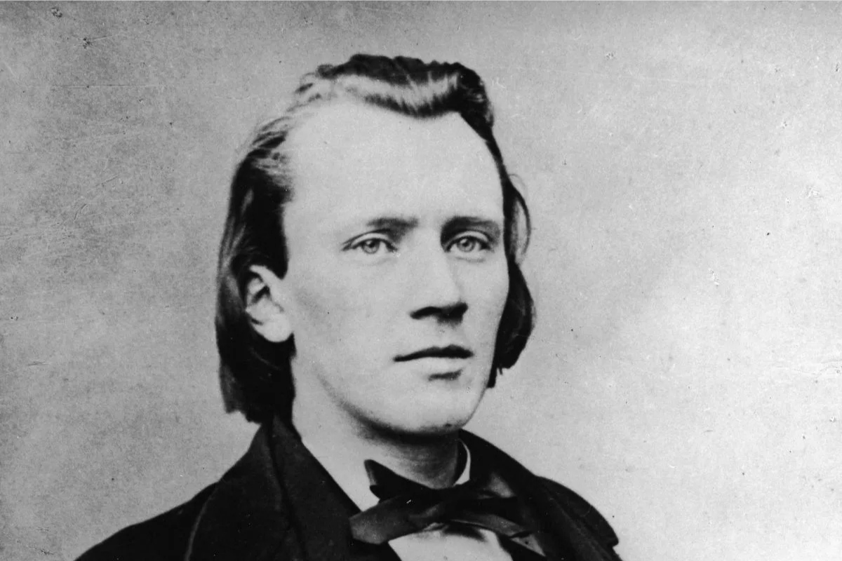 Black-and-white portrait of young man with slicked-back hair