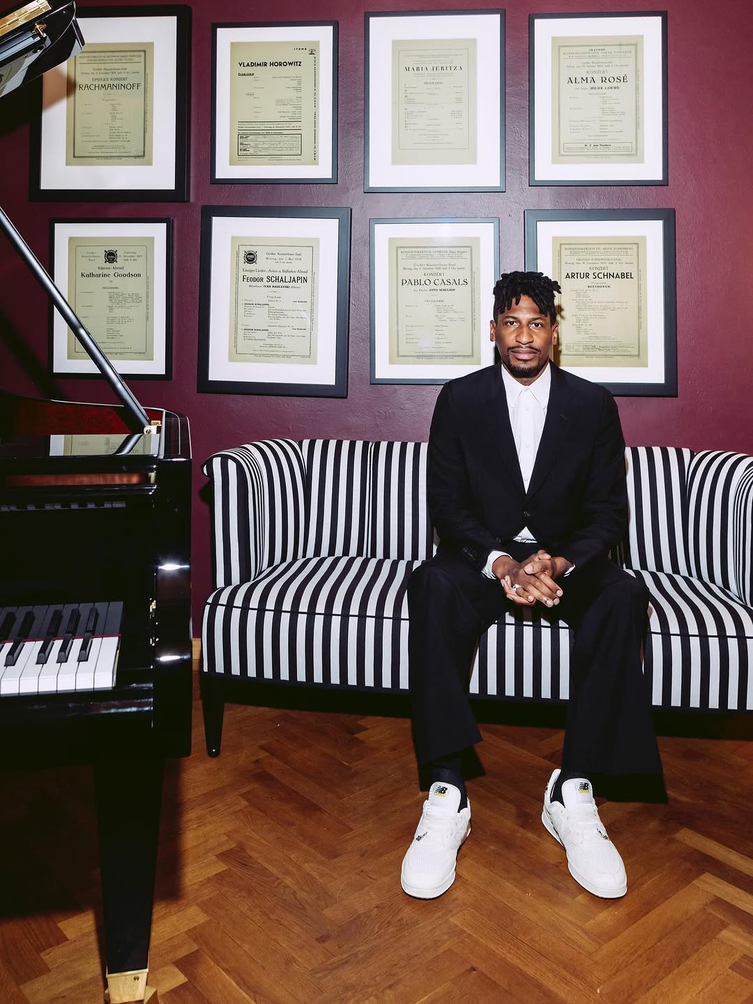 Jon Batiste performing live, showcasing his genre-blending artistry as a pianist, composer, and bandleader whose career spans jazz, film scoring, and global concert stages.