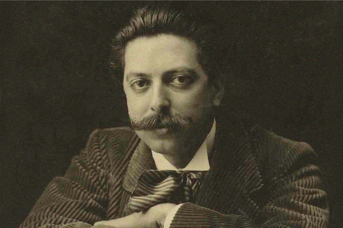 Victorian man with curled mustache in formal portrait