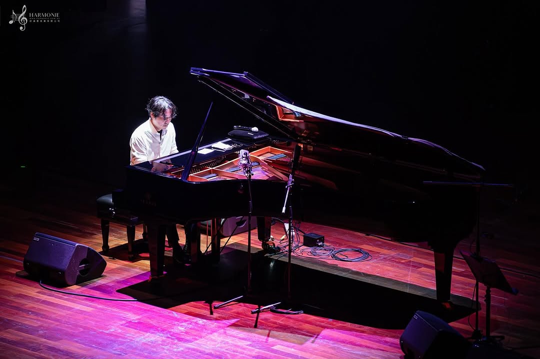 Yiruma performing on stage, presenting his signature piano works that have shaped a global career spanning solo albums, international tours, and acclaimed concert performances.