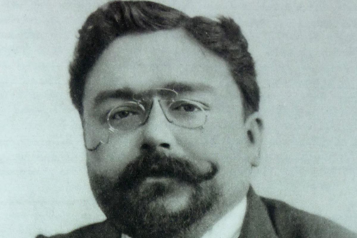 Mustached man wearing glasses in vintage monochrome portrait